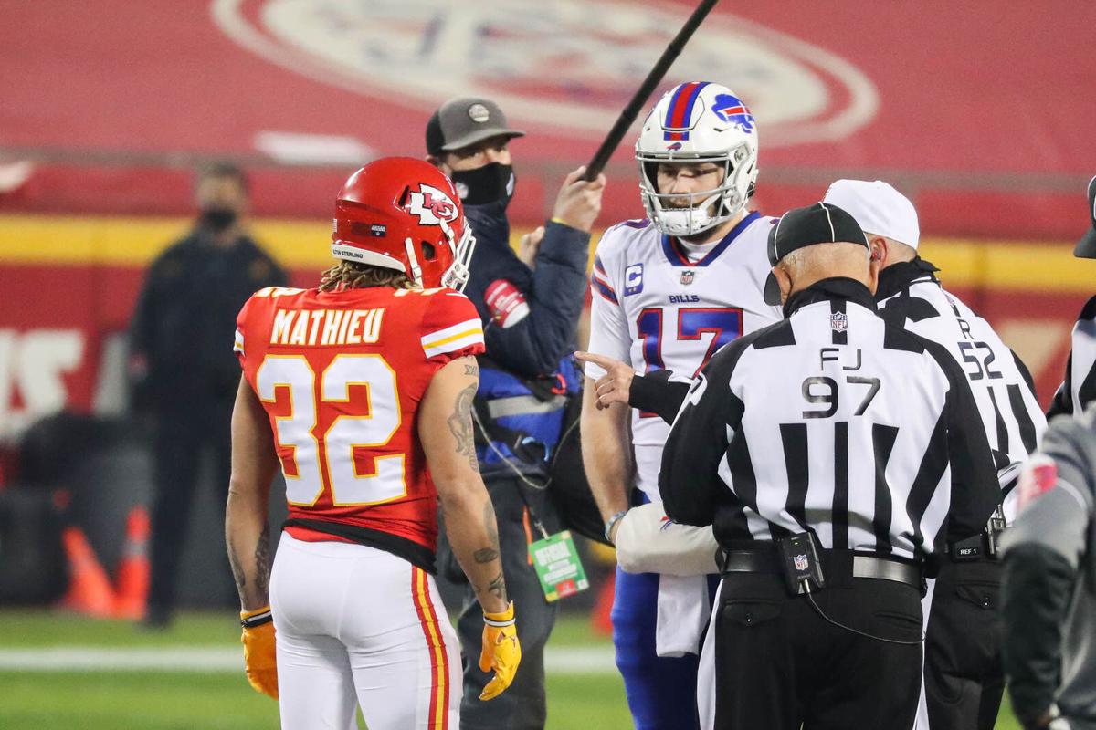 One member each from the Bills and the Chiefs, meeting with the referees to determine the outcome of the overtime coin toss, which the Chiefs would go on to win. Photo by the Buffalo News
