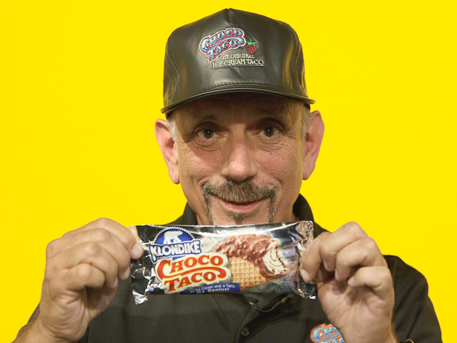 The inventor of the Choco Taco, Alan Drazen, posing with his fan-favorite dessert during an interview on August 6, 2017 in Eaters studio. (Eater)