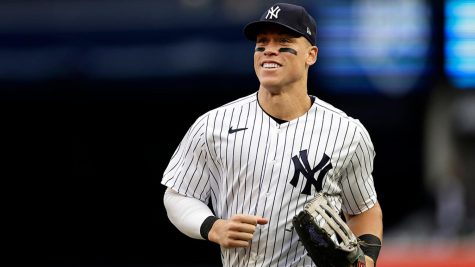 Aaron Judge smiling during a 2022 game against the Baltimore Orioles. (Photo by Adam Hunger)