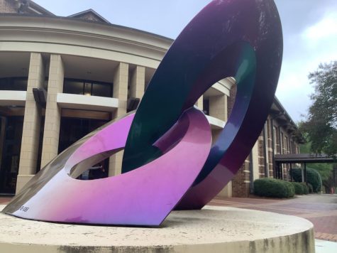 A low angle shot of the Lucky 8 in front of the Science, Art, and Technology building on Charlotte Latin School. (Lucy Dempsey)