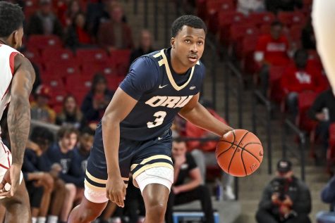 Oral Roberts’ star guard Max Abmas brings the ball up the court and looks for an opening to score. (The Athletic)