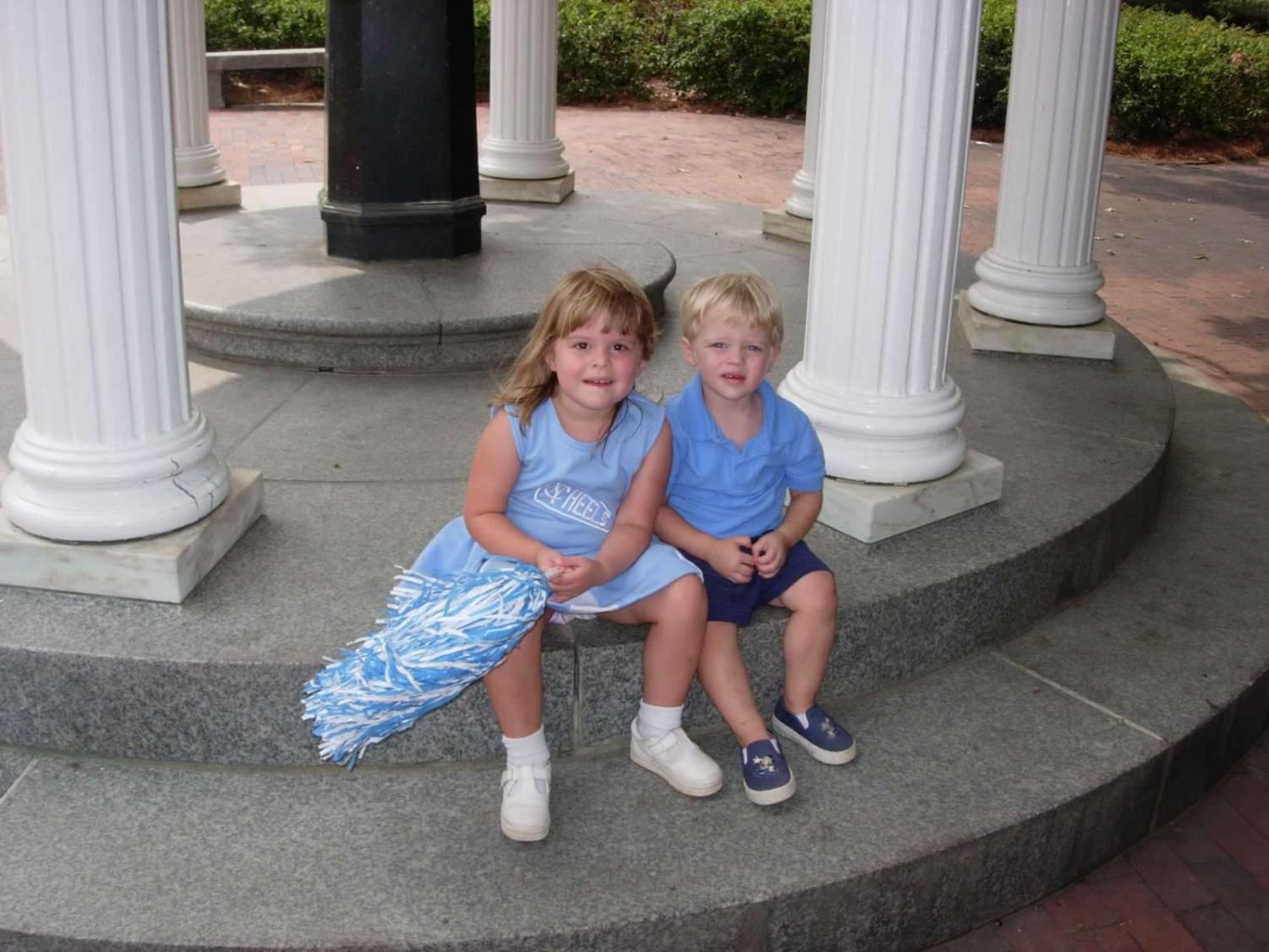 Tommy Beason 24 and his sister Kendall sitting by the Old Well at UNC Chapel Hill, awaiting a football game in 2008. (Sallie Beason)