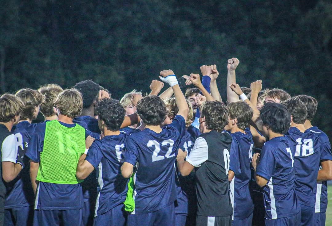The Hawks break the huddle before facing Providence Day in the first round of the NCISAA playoffs. (Zach Krasnigor)